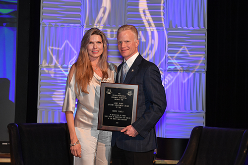 Melissa Moore accepted the Larry Bacon Lifetime Achievement Award on behalf of the Moore family. Photo by Howard Schatzberg.