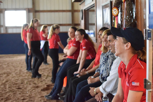 The team and its supporters watching practice.