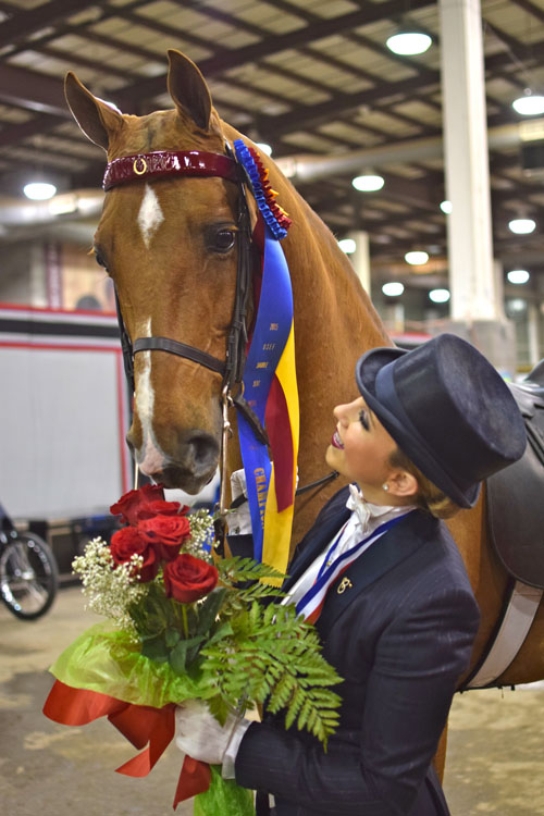 Cameron Kay clinched the final leg of the Equitation Triple Crown when she won the USEF Medal Finals with her partner Reedanns Heir To Glory becoming the first rider to win the Equitation Triple Crown in both the Saddlebred and Morgan worlds.