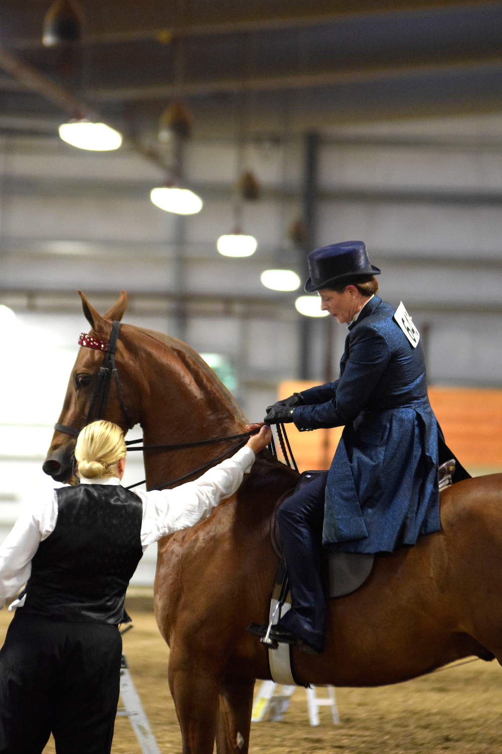 Trainer Neva LaFleur helps Jean Ann Gunderson prepare for a class.