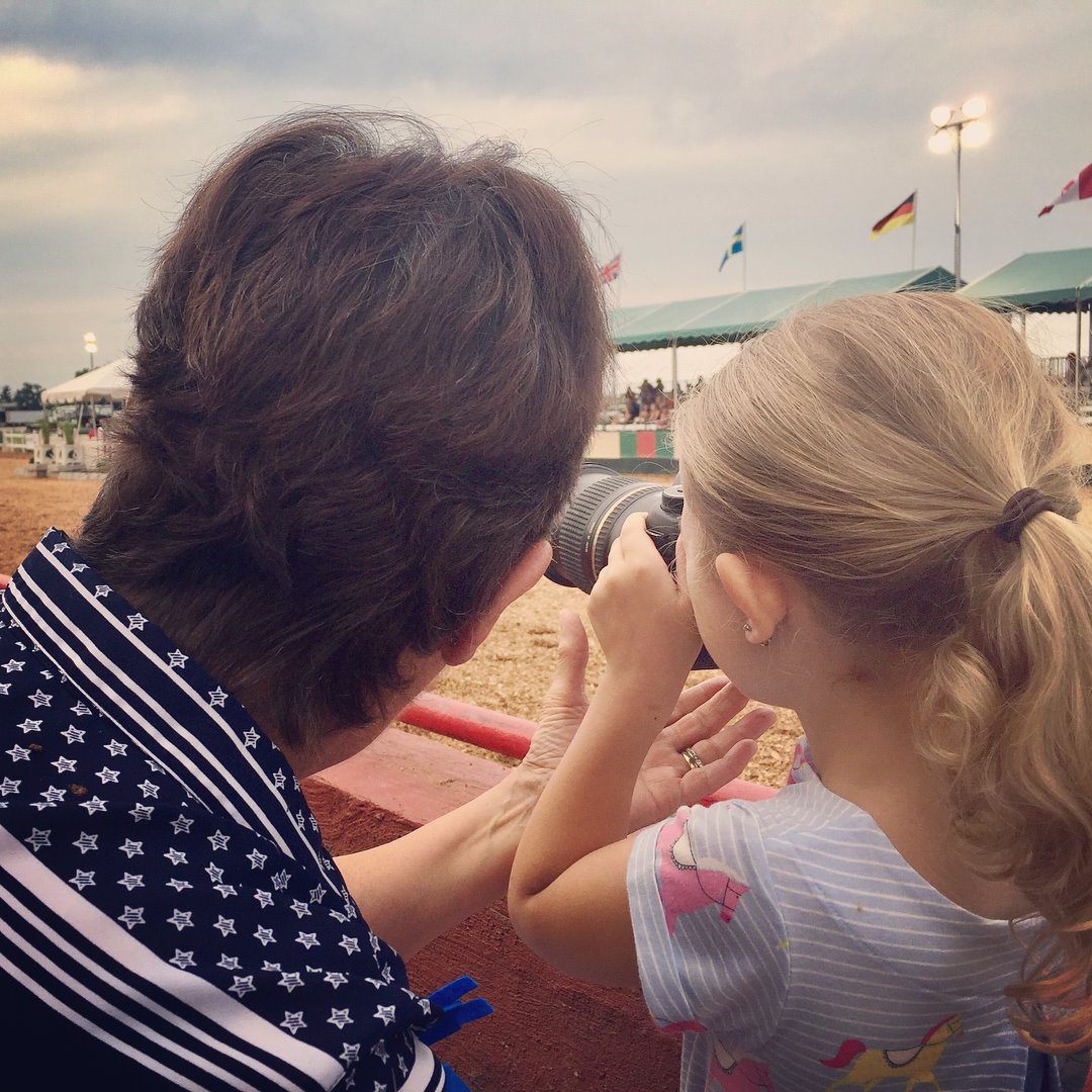 Sandra Hall showing her granddaughter how to use a camera. 